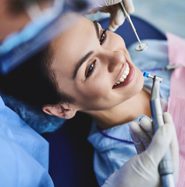 Woman smiling right before her dental cleaning