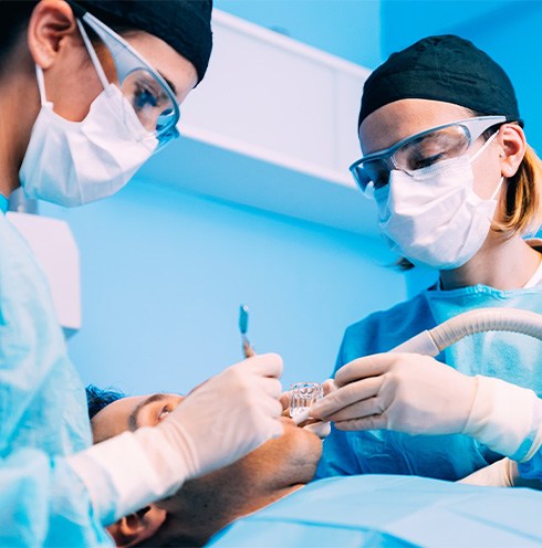 Dentists performing surgery