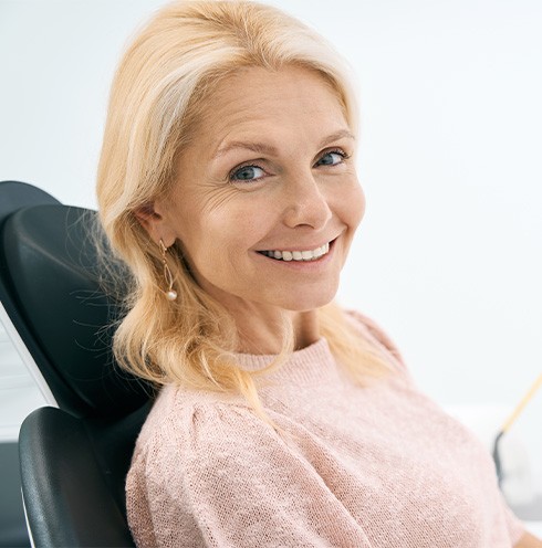 Woman smiling in the dental chair