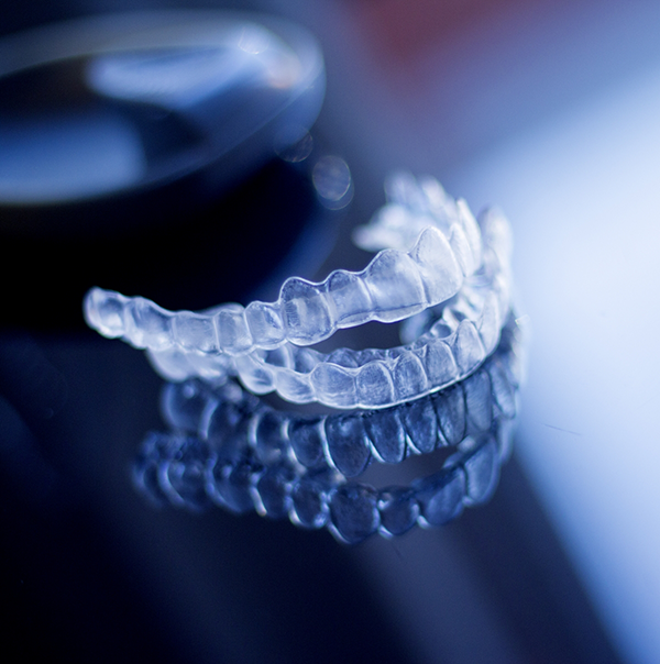 Two Invisalign aligners on a tray