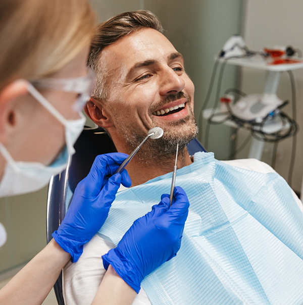 Man receiving a dental checkup