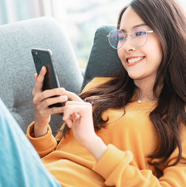 Young woman scrolling on her phone