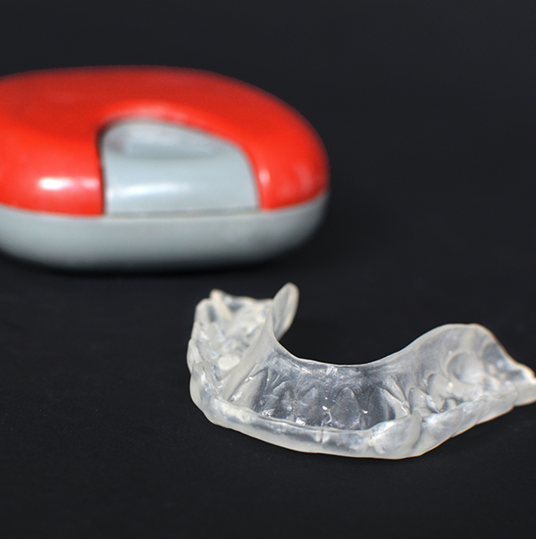 Clear mouthguard tray against black background